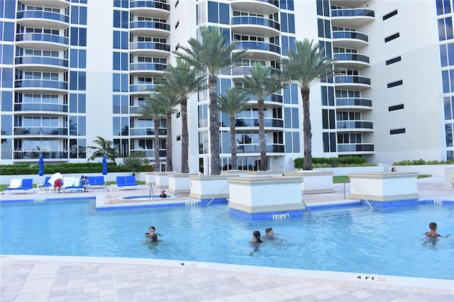 view of pool with a community hot tub