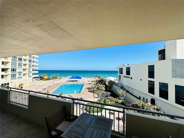 balcony featuring a water view