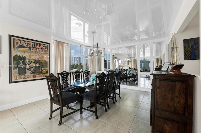 dining room with light tile patterned flooring and a high ceiling