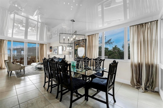 tiled dining space featuring a notable chandelier