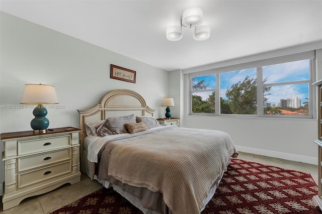 bedroom featuring light tile patterned floors