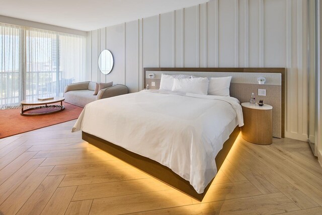 bedroom featuring light parquet floors