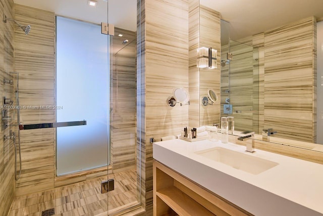 bathroom with an enclosed shower and vanity