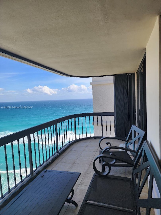 balcony featuring a water view