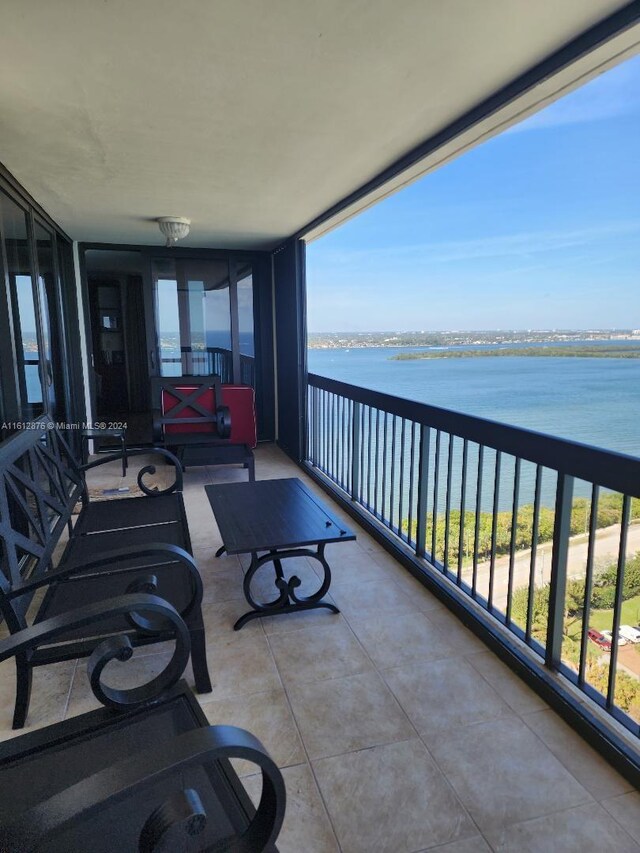 balcony featuring a water view