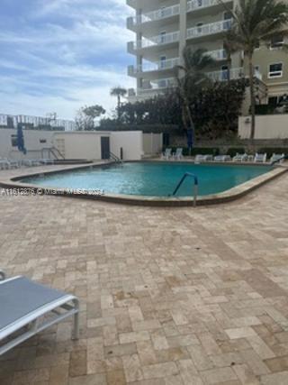 view of pool featuring a patio