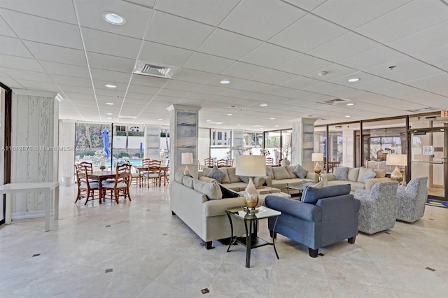 tiled living room featuring expansive windows