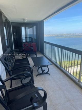 balcony featuring a water view