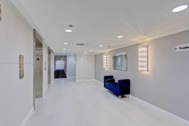 hall featuring light tile patterned flooring