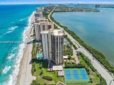 drone / aerial view featuring a beach view and a water view