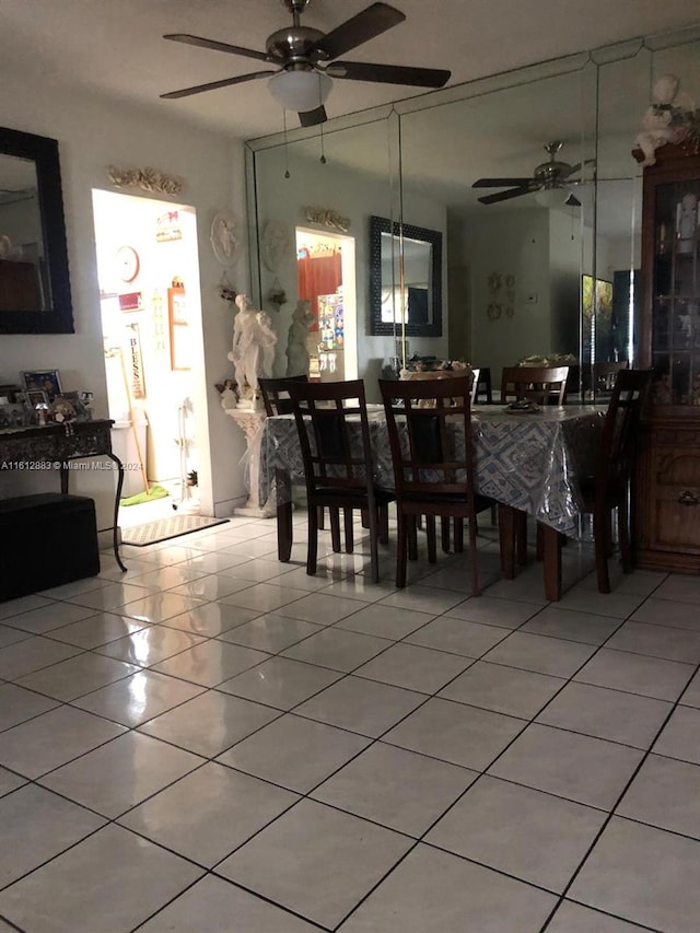 dining space featuring ceiling fan and light tile patterned flooring