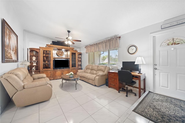 living room featuring ceiling fan and light tile patterned floors