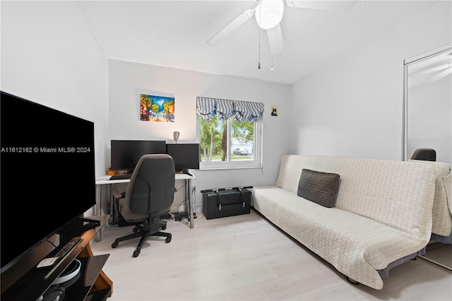 office area with ceiling fan and light wood-type flooring