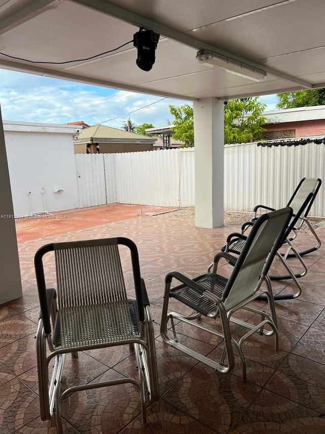 view of patio / terrace featuring a fenced backyard and a ceiling fan