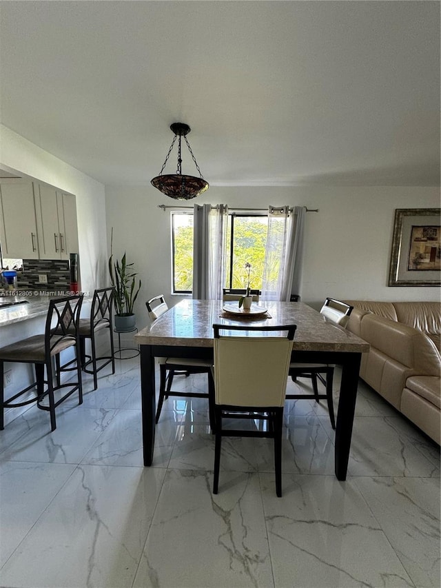 dining room featuring light tile floors