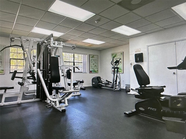 exercise room with a drop ceiling