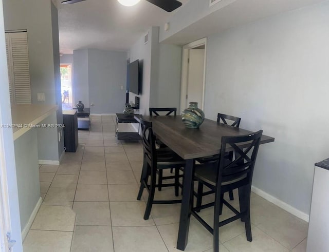 tiled dining room with ceiling fan