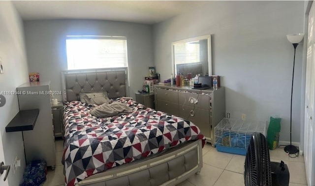 tiled bedroom with multiple windows