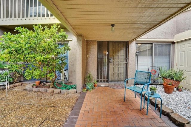 doorway to property featuring a patio