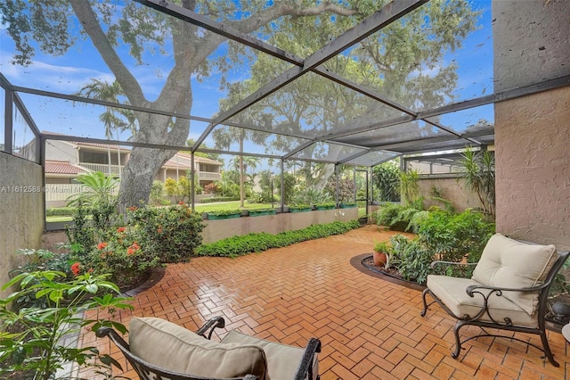 view of patio / terrace featuring glass enclosure