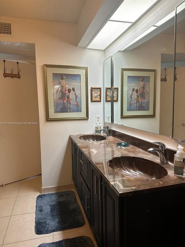 bathroom with tile patterned flooring and vanity