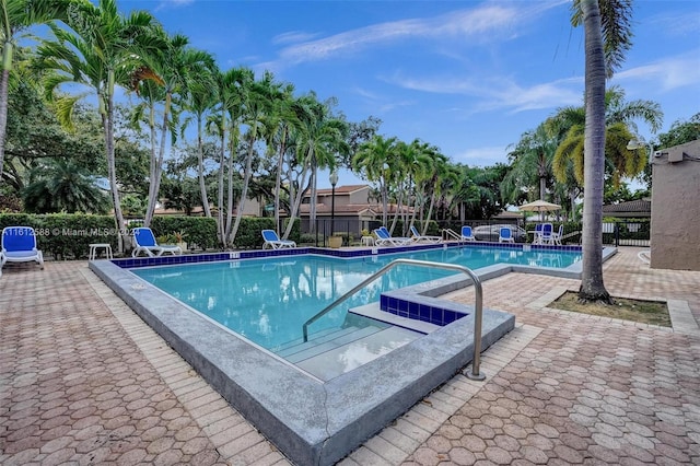 view of swimming pool featuring a patio area