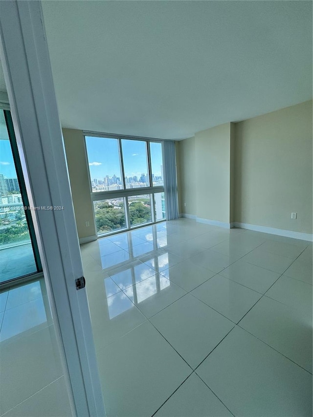 tiled empty room with expansive windows