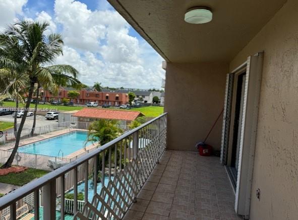 balcony with a community pool