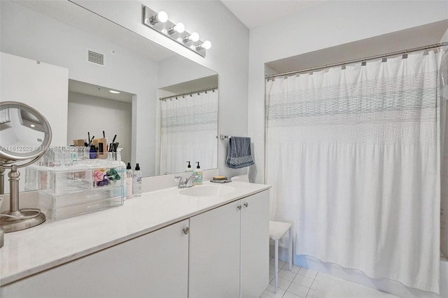 bathroom featuring vanity, tile patterned floors, and shower / bathtub combination with curtain