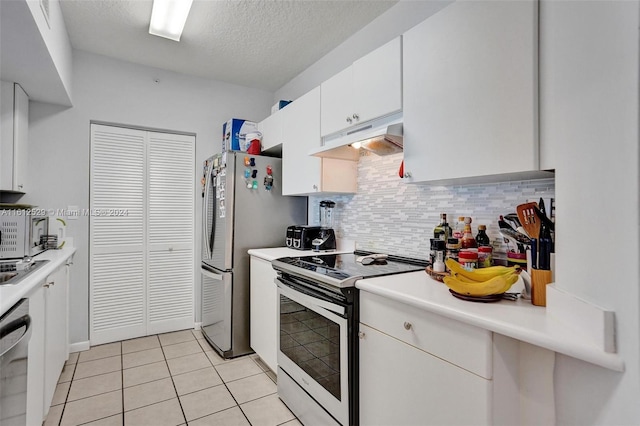 kitchen featuring tasteful backsplash, a textured ceiling, stainless steel appliances, light tile patterned floors, and white cabinetry