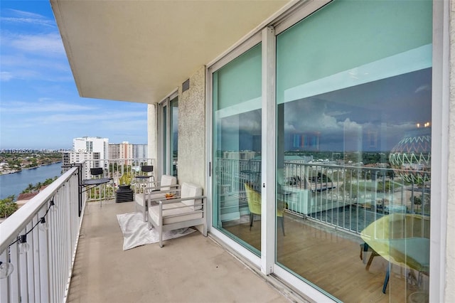 balcony featuring a water view