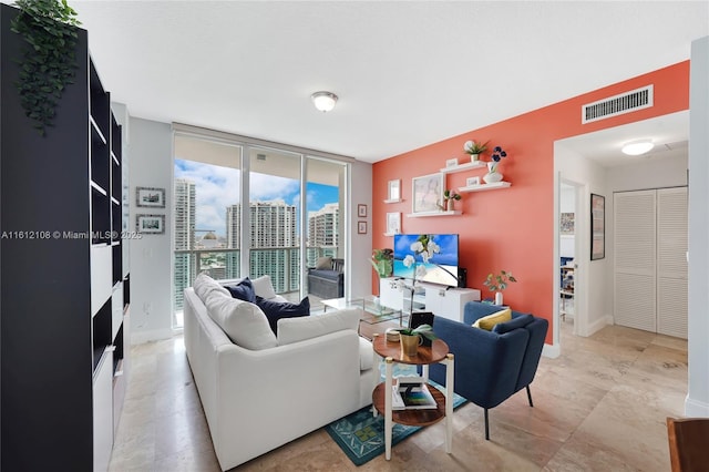 living room featuring a wall of windows