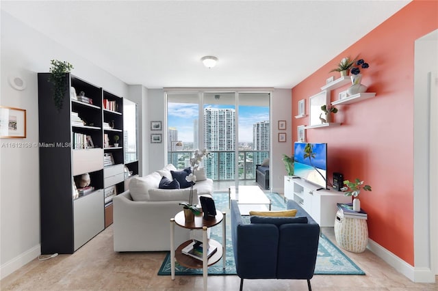 living room featuring floor to ceiling windows