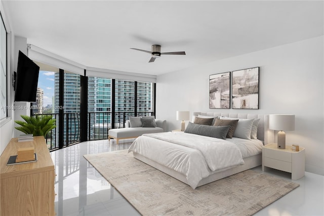 bedroom with access to outside, expansive windows, and ceiling fan