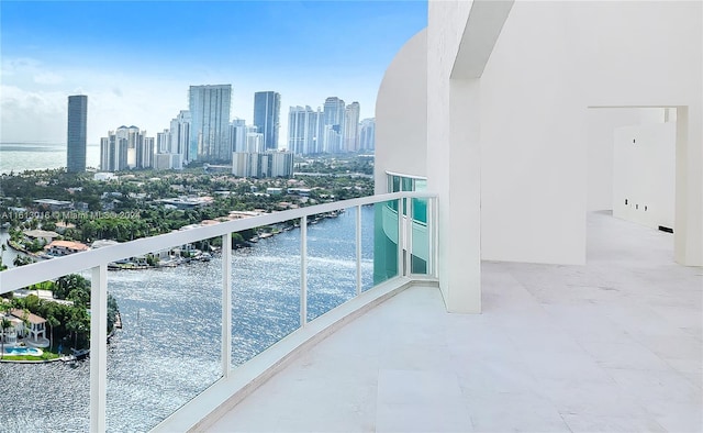 balcony featuring a water view