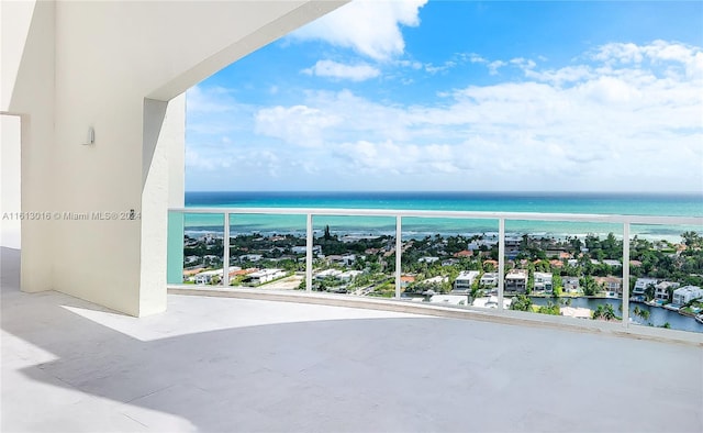 balcony featuring a water view