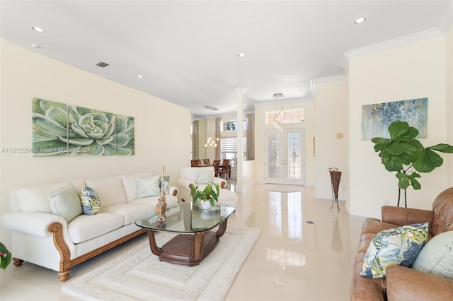 living room with crown molding, tile flooring, and a chandelier