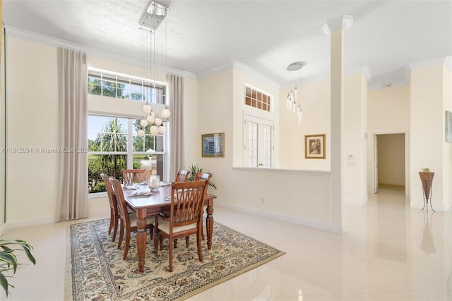 dining room with a healthy amount of sunlight, crown molding, and tile floors