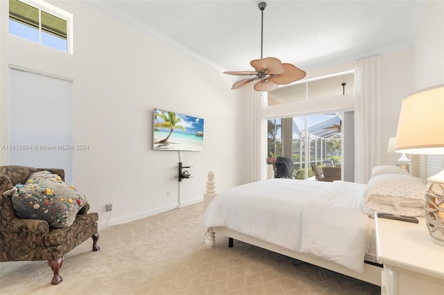 carpeted bedroom with access to outside, crown molding, multiple windows, and ceiling fan