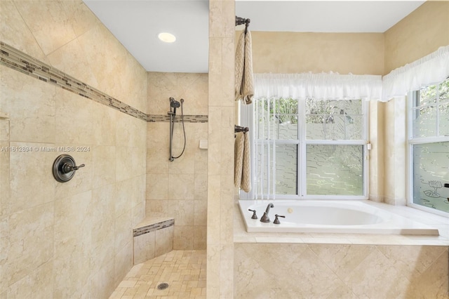 bathroom with shower with separate bathtub