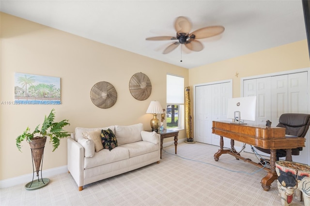 interior space with carpet and ceiling fan