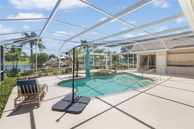 view of swimming pool with glass enclosure, a water view, and a patio area