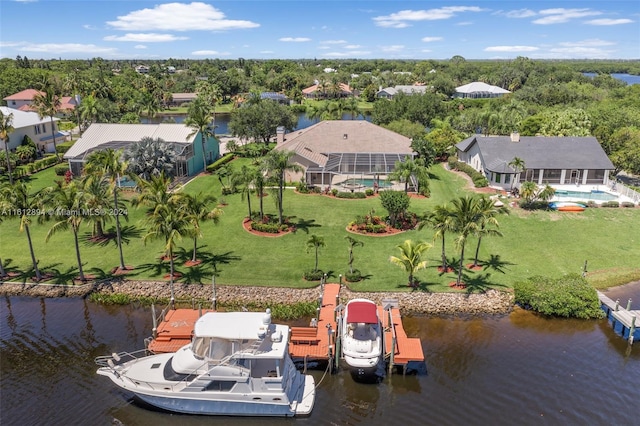 birds eye view of property with a water view