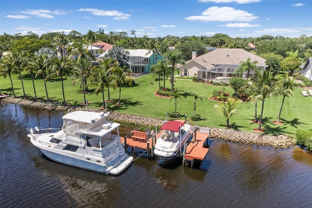 dock area featuring a lanai, a water view, and a yard