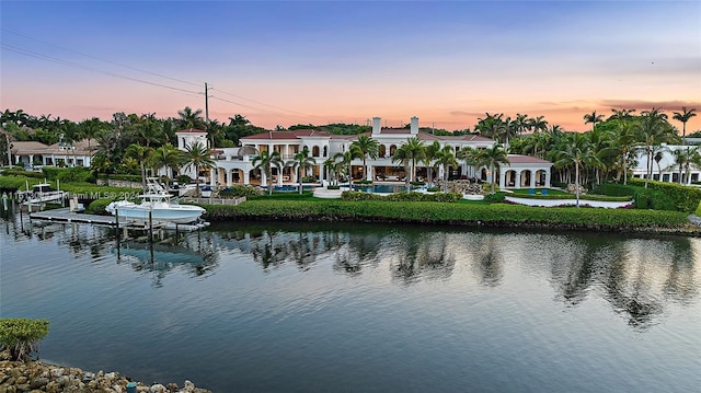 property view of water featuring a boat dock