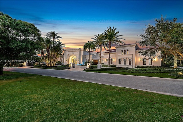 mediterranean / spanish-style house featuring a yard