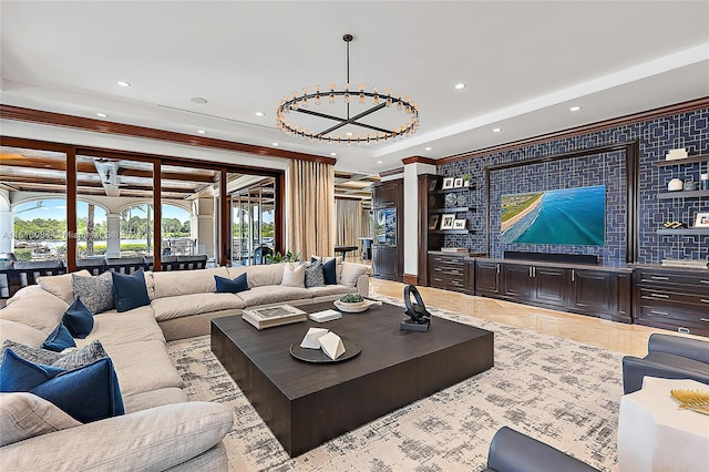 tiled living room with ornamental molding and an inviting chandelier