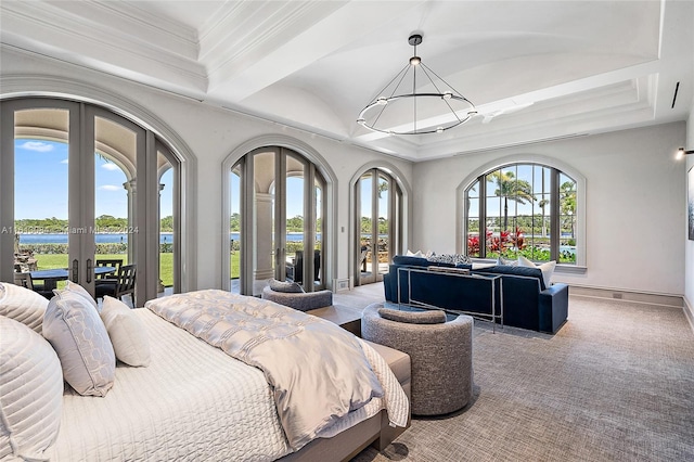 carpeted bedroom featuring multiple windows, crown molding, and access to exterior