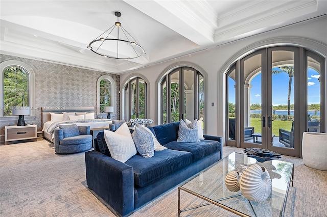 interior space with access to exterior, crown molding, french doors, and a water view