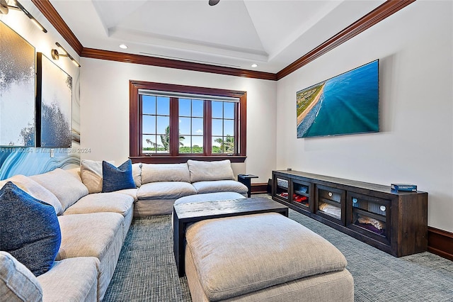 carpeted living room with a tray ceiling and crown molding